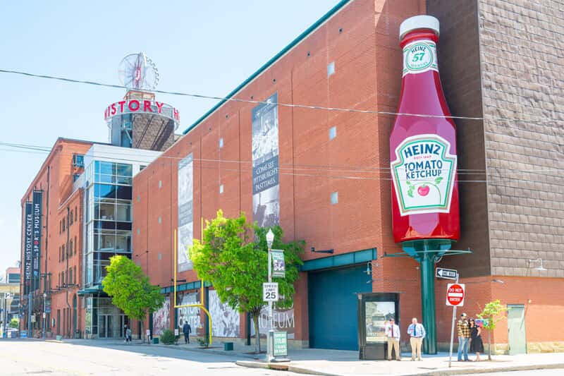 An image of the Heinz exterior signage on the corner of a building.